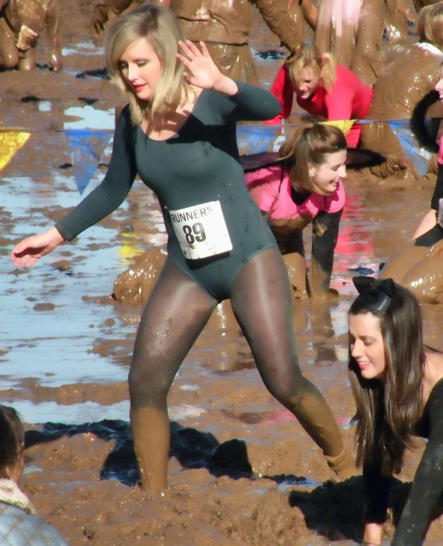 Blonde Messy Girl wearing Muddy Black Opaque Shiny Pantyhose and Green Bodysuit